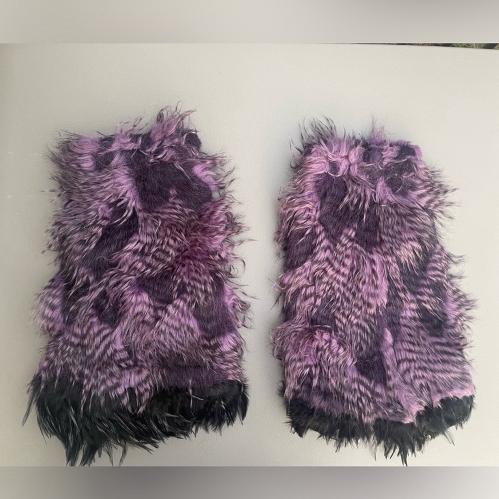 Fluffy leg warmers with feathers.